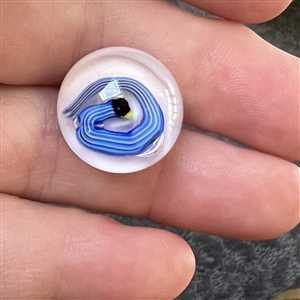 Studio glass paperweight button of a snake.