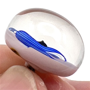 Studio glass paperweight button of a snake.