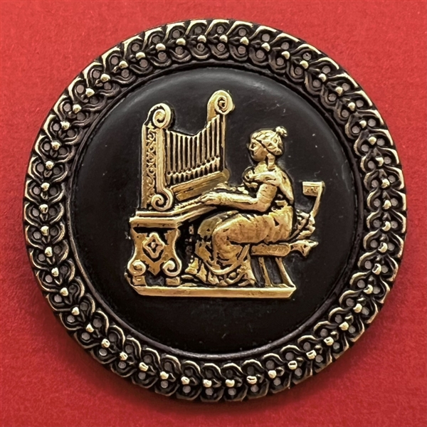 SCARCE brass button of St. Cecilia at the organ.