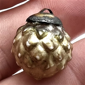 Blown pearlized glass modified ball button. 