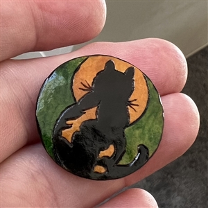 Wood show favor studio button from WSBS 2012 of cat sitting in front of the moon.