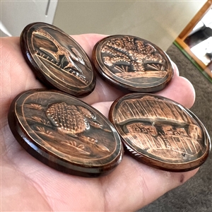 Five iron wood and copper studio buttons by Ralph Briggs.