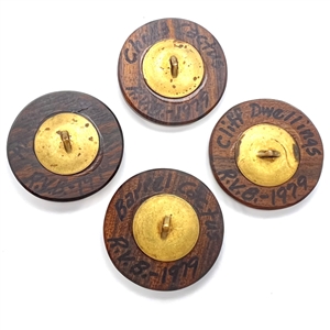 Five iron wood and copper studio buttons by Ralph Briggs.