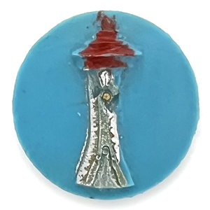 Plastic button of the Space Needle from the 1962 Worlds Fair in Seattle.