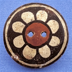 Zia pueblo button of a flower.