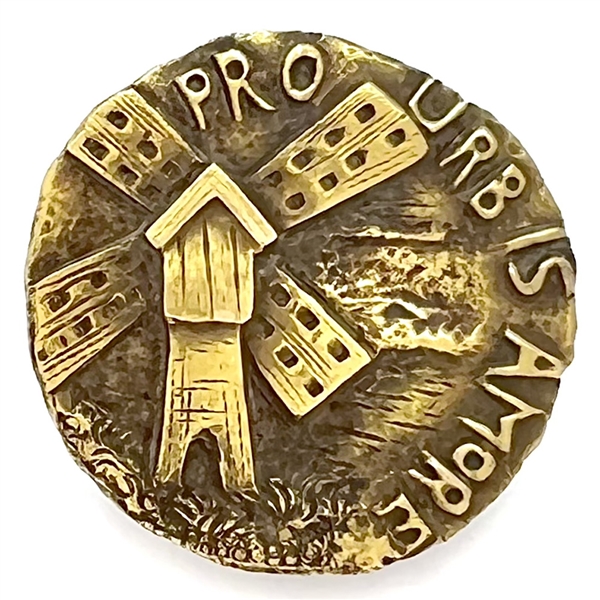 Brass stud of a windmill and “Pro Urb is Amore."