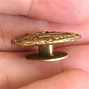 Brass stud of a windmill and “Pro Urb is Amore.