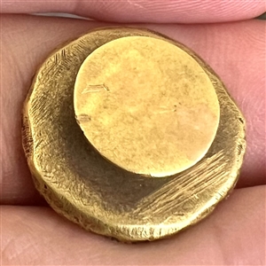Brass stud of a windmill and “Pro Urb is Amore.
