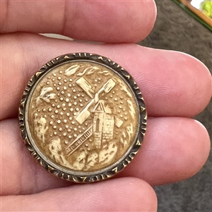 Ivoroid button of windmill with brass rim. 