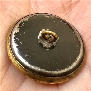 Ivoroid button of windmill with brass rim. 