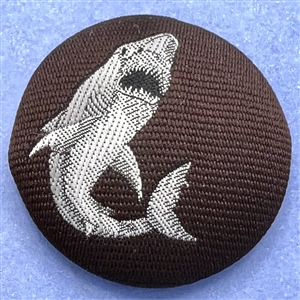 Fabric button of a shark.