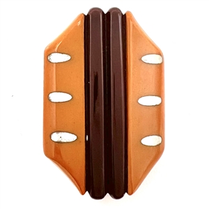 Laminated Vintage Bakelite button with metal inlays.