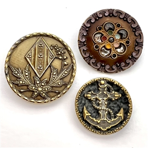 Three Victorian celluloid buttons.