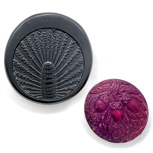 Two Vintage celluloid buttons. 