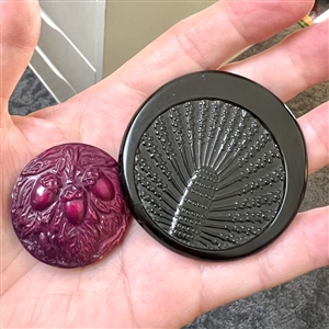 Two Vintage celluloid buttons. 