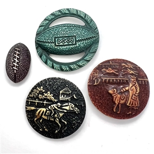 Four buffed Vintage celluloid buttons with sports themes.
