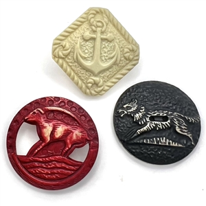 Three buffed Vintage celluloid buttons. 