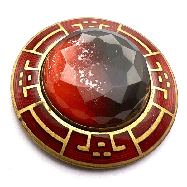 Ombre black/red faceted glass in metal with enamel border.