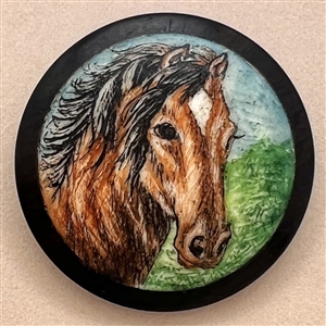 Painted natural material set in boxwood of a horse.