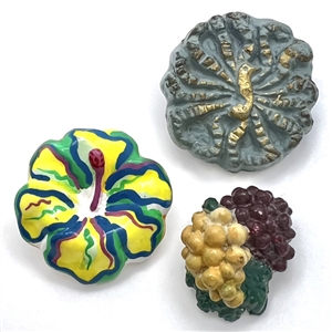 Three plaster buttons, peacock etc…