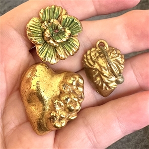 Three metalized buttons including an ANN heart.