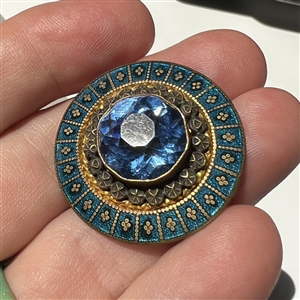 A 19th c. Jeweled button with silvered and gilded brass and enamel border.