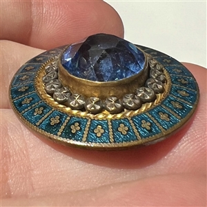 A 19th c. Jeweled button with silvered and gilded brass and enamel border.