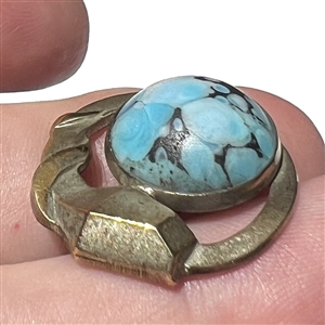 Art Deco snake button of silvered brass with glass.
