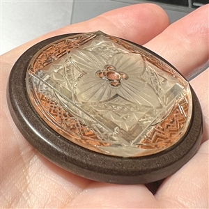 Bohemian pressed glass reverse painted with background reflection showing through.