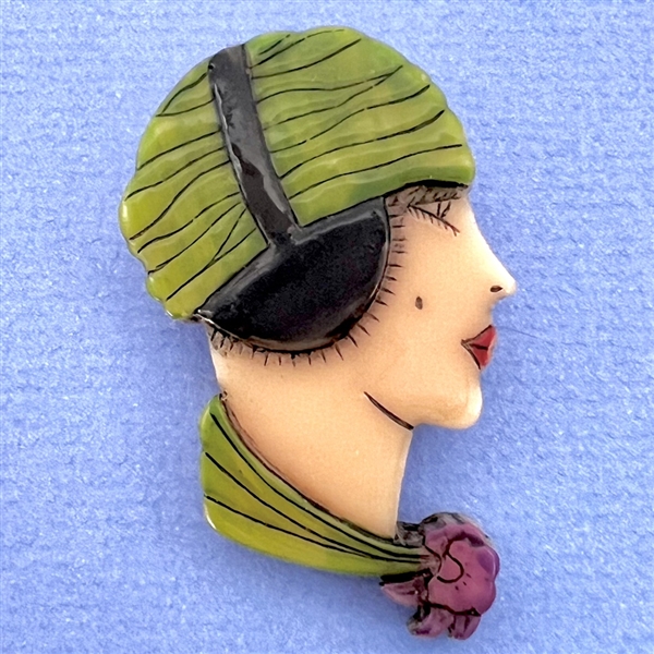 Realistic plastic button of a “Flapper" head.