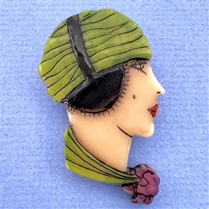 Realistic plastic button of a “Flapper" head.