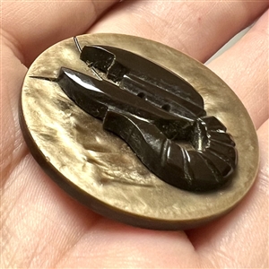 Vintage united plastic button of a crawfish.