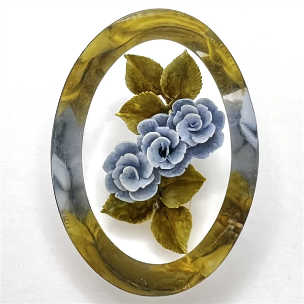 Vintage reverse carved and painted acrylic button of blue roses.