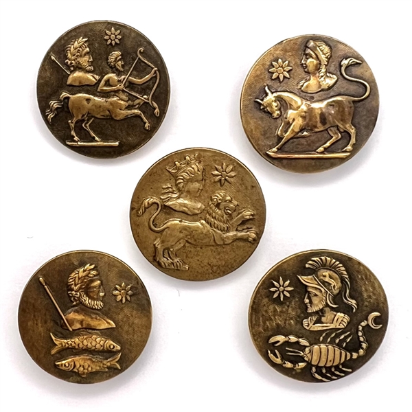 Set of five brass astrology buttons.