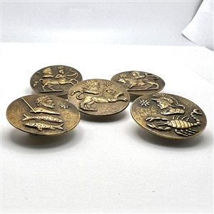 Set of five brass astrology buttons.