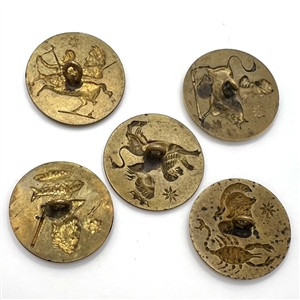 Set of five brass astrology buttons.