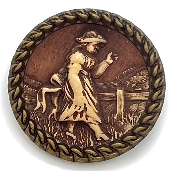 “Victorian Girl" Ivoroid button mounted in brass.