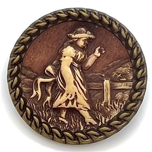 “Victorian Girl" Ivoroid button mounted in brass.