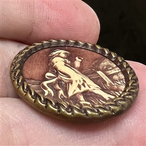 “Victorian Girl Ivoroid button mounted in brass.