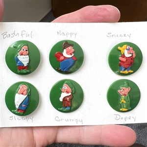 Six Disney Vintage plastic buttons of Snow Whites dwarfs.