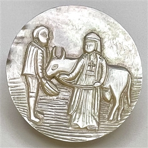 Bethlehem pearl button of two people and an ox.
