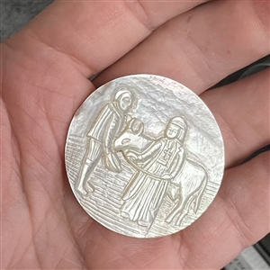 Bethlehem pearl button of two people and an ox.