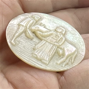 Bethlehem pearl button of two people and an ox.