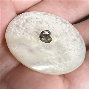 Bethlehem pearl button of two people and an ox.