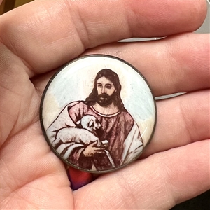 Motiwala enamel button of Jesus holding a lamb.