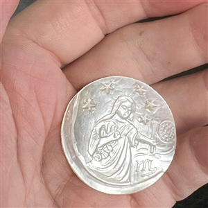 Bethlehem pearl button of Jesus performing a miracle.