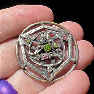 Jeweled button set in silvered brass, possibly from the suffragette movement.