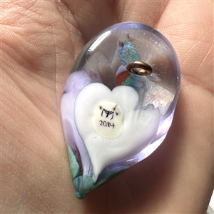 Mary Gaumond's hummingbird drinking from flower glass studio button.