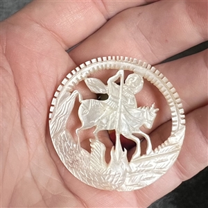 Bethlehem pearl button of St. George slaying the dragon.