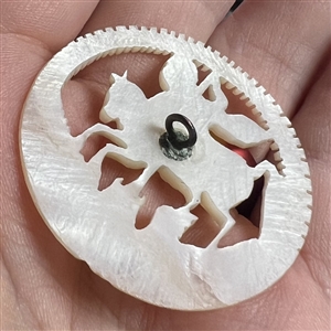 Bethlehem pearl button of St. George slaying the dragon.